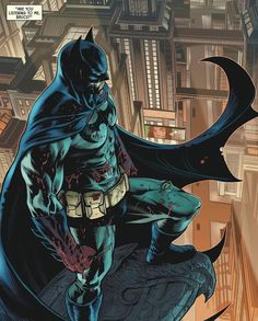 a batman standing on top of a building with his hands in his pockets and looking down at the ground