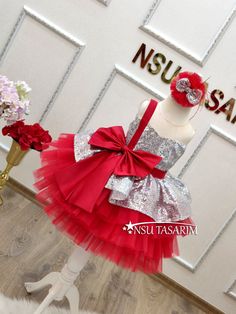 Christmas dress. Gift package. Baby girl dress. Holiday dress. Silver Sparkle Christmas dress.Elevate your little one's holiday celebrations with our enchanting Shimmering Scarlet baby dress. This delightful knee-length Christmas costume is designed to make her the star of the holiday season. With its stunning combination of bright red and shimmering silver, adorned with a large red bow on the bodice and a cascading red tulle skirt, it's the perfect choice for creating cherished holiday memories Elegant Pink Princess Dress For Christmas, Princess Style Wedding Dress For Christmas, Pink Princess Christmas Dress, Princess Holiday Dress For Wedding Party Season, Princess Style Holiday Dress For Wedding Party Season, Princess Style Wedding Holiday Dress For Party Season, Princess Style Wedding Dress For Party Season, Pink Princess Dress For Christmas Party, Princess Holiday Dress For Party Season