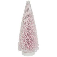 a small pink christmas tree in a white vase