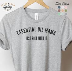 Essential Oil Mama Just Roll With It T Shirt. This updated unisex essential fits like a well-loved favorite. Super soft cotton and excellent quality print makes one to fall in love with it over and over again. .: 100% Soft cotton (fiber content may vary for different colors) .: Retail fit .: Tear away label .: Runs true to size Essential Oil Shirts, Just Roll With It, Jw Pioneer Gifts, Pioneer Gifts, Jw Gifts, Green Item, Printable Gift, Typography Prints, T Shirts With Sayings