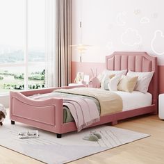 a bedroom with pink walls and white bedding in the center, along with a dog on the floor