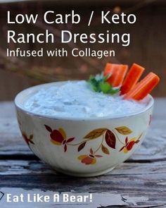 a bowl filled with ranch dressing and carrot sticks