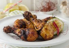 grilled chicken and vegetables on a white plate