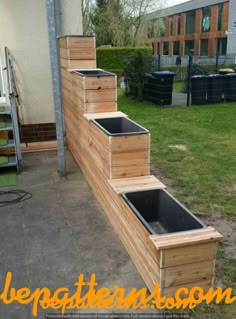 a set of stairs made out of wooden pallets on the side of a building