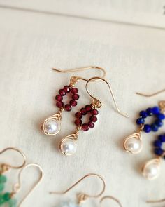 Dainty garnet & pearl dangle earrings with a choice of 14K gold-filled or Sterling Silver. Lovely, tiny & petite. These earrings are an amazing gift & easily loved by everyone. They are lightweight and delicate. ✨ Garnet is a stone of love & devotion. A symbol of dreams into reality & success in business matter. A birthstone for January ✨ * These earrings won't tarnish or turn color. You can wear them every day! * Hypoallergenic. You won't have to worry about allergies from metal such as nickel. Short Dangle Earrings, Gold Dangle Beaded Earrings With Natural Stones, Gold Natural Stones Drop Pearl Earrings, Gold Dangle Pearl Earrings With Natural Stones, Gold Pear-shaped Pearl Earrings With Ear Wire, Unique Pearl Earrings, Elegant Wire-wrapped Yellow Gold Pearl Earrings, Crystal Teardrop Earrings, Wire Wrap Jewelry Designs