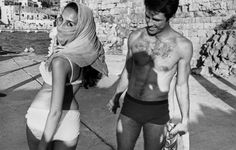 a man and woman in bathing suits walking next to each other, with the caption urbanism v 1965 roku