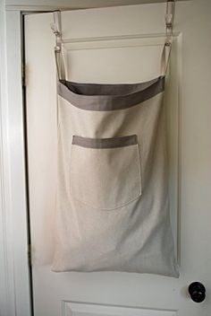 a canvas bag hanging on the door