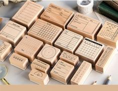 several wooden stamps with numbers and times on them sitting next to each other in rows