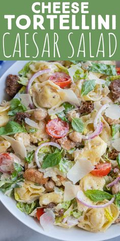 a white bowl filled with pasta salad on top of a blue and green table cloth