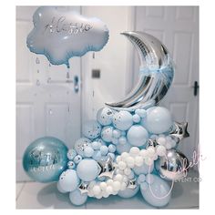 an image of a balloon arch with moon and stars on it for a birthday party