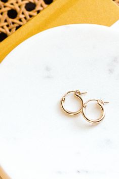 These tiny hoops will be your new favorite! Our Everyday Hoop Earrings are simple, lightweight and go with just about any outfit! Pick from gold fill or sterling silver - materials durable enough for everyday wear. Find dainty necklaces, dainty stacking rings, and everyday bracelets, and more at Simple & Dainty! Everyday Bracelets, Necklaces Dainty, Dainty Necklaces, Everyday Bracelet, Mini Earrings, Trendy Earrings, Dangling Earrings, Stunning Earrings, Dainty Earrings