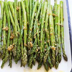 the asparagus are ready to be cooked in the oven and put into the baking dish