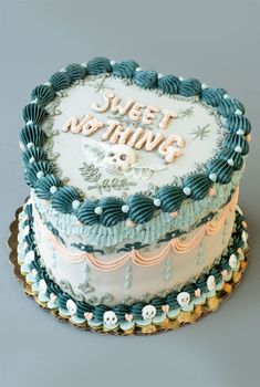 a cake with frosting that says sweet nothing on top and flowers around the edges