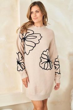 This whimsical sweater dress is an ode to simpler times. Delicate floral embroidery and scalloped accents evoke memories of carefree afternoons in a sun-dappled meadow. At the same time, its cozy knit fabric and effortless pullover silhouette keep you grounded in the present. Destined to become your go-to piece for lazy weekends and casual gatherings with friends, this lightweight wonder transitions gracefully. Whether you pair it with sneakers for a retro-inspired look or heeled booties for nig Beige Crew Neck Dress For Spring, Beige Crew Neck Spring Dress, Knee-length Knit Sweater For Spring, Beige Crew Neck Sweater Dress For Spring, Spring Long Sleeve Soft Knit Sweater Dress, Beige Floral Embroidery Sweater For Spring, Soft Knit Long Sleeve Sweater Dress For Spring, Spring Beige Sweater With Floral Embroidery, Spring Soft Knit Long Sleeve Sweater Dress