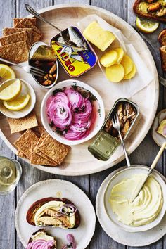 an assortment of food on a wooden table