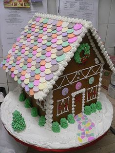 a decorated gingerbread house on top of a table