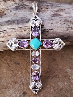 New NICKY BUTLER 925 Sterling Silver ONE OF A KIND Mojave Turquoise, African Amethyst, Moonstone, and Pearl Multi Gem Designer Signed Large 3-1/8" Cross Pendant. Comes with original NB romance card and black velvet gift pouch. Shipped FAST with USPS First Class Package. Shipping includes tracking. 📬💌 I'm very proud of my Nicky Butler collection and strive for 100% Positive Feedback. Always happy to combine shipping. ⭐⭐⭐⭐⭐ Purple Multi-stone Bohemian Jewelry, Purple Bohemian Multi-stone Jewelry, Purple Southwestern Jewelry For Gifts, Purple Southwestern Jewelry For Gift, Southwestern Style Purple Jewelry For Gift, Purple Southwestern Style Jewelry For Gift, Spiritual Turquoise Gemstones With Accents, Spiritual Turquoise Necklace With Large Stone, Gift Pouch