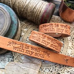 three leather bracelets that say it is well with my soul