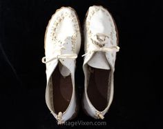 1920s casual shoes!  These "as is" oxford pumps are authentic vintage deadstock, nearly antique, from a drygoods store that opened in 1911.  They have a classic lace-up and crafty cross-stitched seams reminiscent of a campfire craft project.  The leather soles are rustic looking, and they have a 5/8-inch rubber heel.  New-old stock from the late 1920s to early 30s, with the original Dun-Deer shoebox panel included.  Note that the condition makes them unwearable (see Condition Detail below), and Vintage Low-top Oxfords With Rubber Sole, Vintage Wingtip Oxfords For Spring, Spring Vintage Oxfords With Almond Toe, Vintage Almond Toe Oxfords For Spring, Vintage Lace-up Oxfords With Rubber Sole, Vintage Oxfords With Brogue Detailing For Spring, Vintage Oxfords With Leather Sole, Vintage Closed Toe Oxfords With Rubber Sole, Vintage Brogue Oxfords With Closed Toe