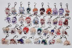 a bunch of key chains with anime characters on them