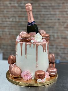 a cake decorated with pink and gold icing