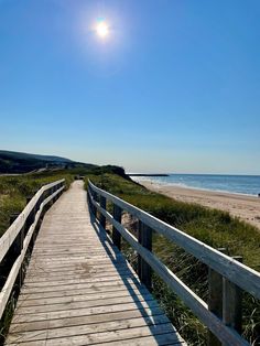 a wooden walkway leading to the beach