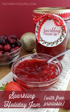 a jar of jam next to some cherries