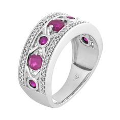 Decorated with alternating large and small round-cut rubies set within an "X" pattern, this 10k white gold ring lends a touch of distinction to your ensembles.RING DETAILSWidth: 8.35 mmMetal: 10k white goldPlating: rhodiumFinish: polishedPackaging: boxedSTONE DETAILSStone type: rubyTotal weight: 1/10 ct.Center stone size: 6 mm x 4 mmShape: roundSetting: prongDIAMOND DETAILSTotal weight: 1/5 ct.Color grade: I-JClarity: I2-I3Shape: roundSetting: prongGemstones may have been treated to enhance thei White Gold Diamond Ring With Ruby, White Gold Ruby Rings With Diamond Accents, White Gold Ruby Ring With Round Band, Fine Jewelry White Gold Ruby Ring, Fine Jewelry Ruby Ring With Channel Set Round Shape, Classic White Gold Ruby Ring With Diamond Accents, White Gold Ring With Diamond Accents And Lab-created Ruby, White Gold Ruby Anniversary Ring, White Gold Ruby Ring For Anniversary