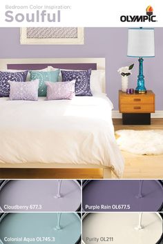 a bedroom with purple walls, white bedding and blue accents on the nightstands