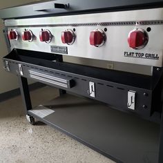 an image of a stove top with four burners on the front and two ovens on the back