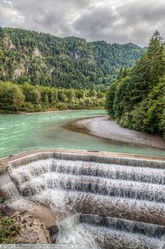 the water is running over the dam and into the river to get some fresh air