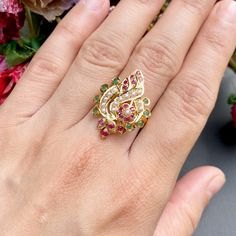 Boasting a sophisticated multicoloured jadau ring in 22ct gold, this timeless piece offers an alluring floral design. Weighing 4.4 GMs, its combination of style and resilience make it an apt accessory for any ensemble or event. Handcrafted with expertise, it promises a high-quality finish. Price Breakup Summary Component Rupees % of Total 22k Gold 21,384 74.0% Stones & Beads 1,848 6.4% Making Charges 3,849 13.3% Taxes (GST) 812 3.0% Total 28,894 100.0% View Detailed Price Breakup Watch Video Her Elegant 22k Gold Ring For Festive Occasion, Elegant Yellow Gold Meenakari Rings, Elegant Green Rings For Festive Occasions, Elegant Ruby Ring For Festive Occasions, Fusion Style Multicolor Wedding Rings, Elegant Meenakari Rings For Anniversary, Elegant Festive Rings For Anniversary, Elegant Festive Anniversary Ring, Elegant 22k Gold Green Ring