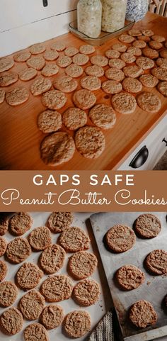 peanut butter cookies are sitting on top of a cookie sheet and in front of some jars