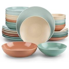 a stack of different colored bowls and plates