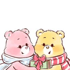 two teddy bears sitting next to each other with a gift box in front of them