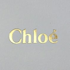 the word choe written in gold on a white background