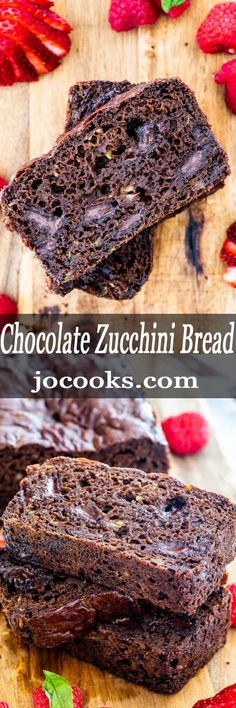 chocolate zucchini bread on a cutting board with raspberries in the background