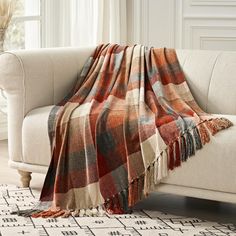 a couch with a blanket on top of it