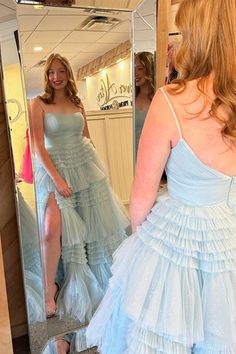 Constructed with a combination of tulle and spaghetti straps, this formal gown showcases an A-line silhouette with a pleated bodice and full-length tiered ruffles. The light blue color adds a touch of elegance, while the zip-up back and built-in bra provide practicality and comfort. SKU: 3415 Light blue color Tulle material A-line silhouette Pleated bodice with spaghetti straps Tiered ruffles full length skirt Zip-up back Built-in bra Ship in 7-10 business days Size: US 2-16. We offer free retur Tiered Tulle Gown For Gala, Tiered Tulle Gown With Ruffles, Tiered Gown For Prom Season, Tulle Gown With Spaghetti Straps For Gala, Wedding Gown With Ruffled Straps, Tiered Tulle Gown With Fitted Bodice, Fitted Bodice Tiered Tulle Gown, Fitted Bodice Tulle Tiered Gown, Tiered Tulle Gown For Formal Occasions