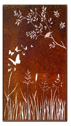 a metal wall hanging with butterflies flying over grass and flowers in the air, on an orange background