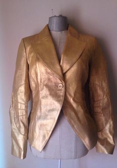 Fitted Single Breasted Leather Jacket For Party, Fitted Leather Party Blazer, Gold Winter Blazer For Formal Occasions, Gold Blazer For Formal Winter Occasions, Gold Single Breasted Blazer For Party, Fitted Metallic Blazer For Formal Occasions, Gold Single-breasted Blazer For Party, Luxury Gold Single-breasted Blazer, Winter Gold Single Breasted Blazer