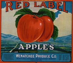 an old red label for apples with mountains in the background