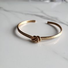 18k gold plated love knot adjustable cuff bracelet Love knot bracelet is 18k gold plated , hypoallergenic Adjustable cuff and tarnish free Simple and pretty bracelet Bracelet Simple, Bracelet Dainty, Knot Bracelet, Pretty Bracelets, Love Knot, Body Jewellery, Everyday Jewelry, Gift Christmas, Jewelry Gift