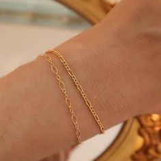 14k Gold Filled - Handcrafted - Waterproof - Tarnish resistant. This 14k gold filled dainty bracelet set is perfect for gifting. Featuring 1 normal figaro chain bracelet and 1 daintier figaro bracelet. It's the perfect duo! Dainty Adjustable Tarnish Resistant Chain Bracelet, Dainty Adjustable Tarnish-resistant Chain Bracelet, Everyday Hypoallergenic Gold-plated Bracelet, Adjustable Gold Figaro Chain Bracelet, Adjustable Figaro Chain Gold Bracelet, Classic Adjustable Figaro Chain Bracelets, 14k Gold Bracelet With Delicate Chain For Gift, Dainty Delicate Chain Bracelet As Gift, Dainty Delicate Chain Bracelet For Gifts