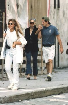 a man and woman walking down the street