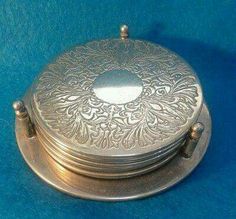 an ornate silver box on a blue background