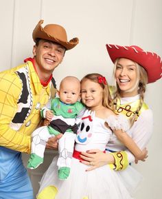 three people in costumes pose for a photo