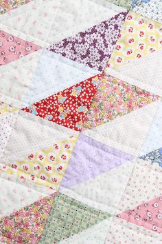 a close up view of a colorful quilt