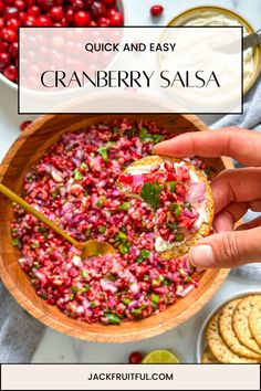 cranberry salsa in a wooden bowl with crackers on the side and text overlay reading quick and easy cranberry salsa