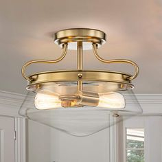 a light fixture in a room with white walls